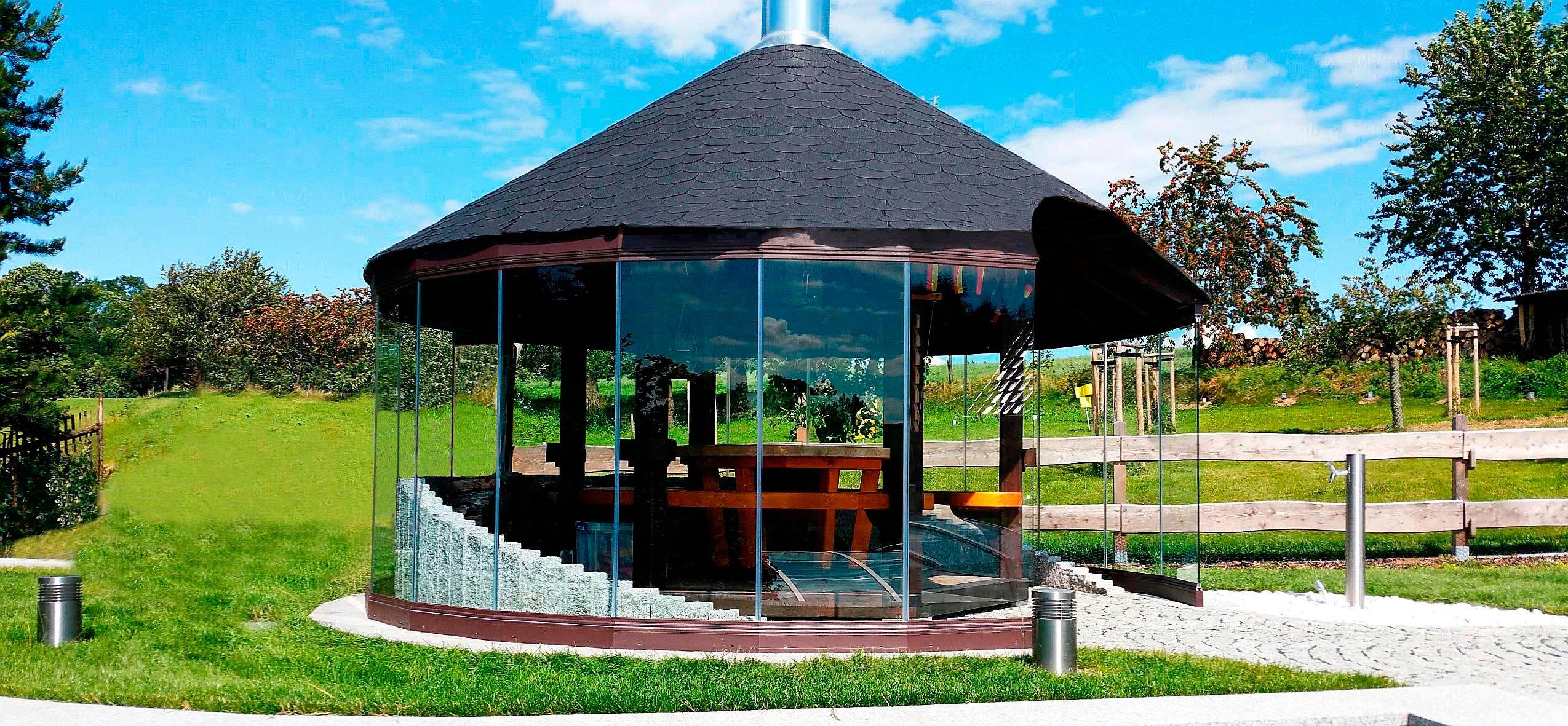 Glass enclosure in a garden in Germany grill